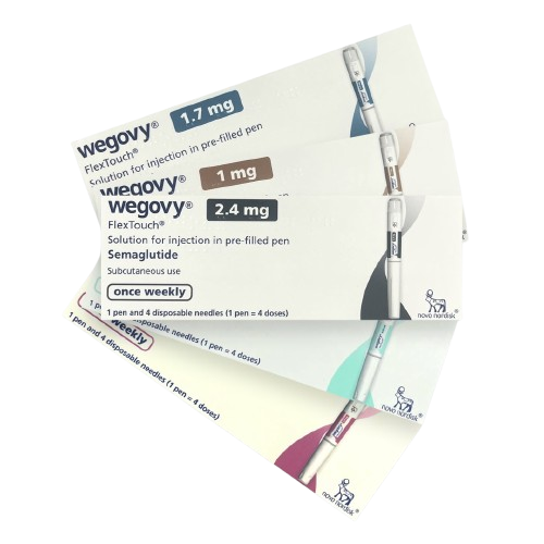 Several packs of Wegovy, all splayed out over a clear white background.